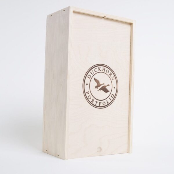 2 Bottle Pinewood box with vertical sliding lid and mobile plywood dividers. USA sourced, FSC Certified Pinewood. Thickness 3/4". Birch plywood Lid and dividers . Staples assembly. Printing: One ( 1 color ) silkscreen) orfire branding on Lid INSIDE DIMENSIONS: 12-1/4" L X 6-7/8" W X 3-3/8" H OUTSIDE DIMENSIONS: 13" L X 7-1/2" W X 4-1/4" H